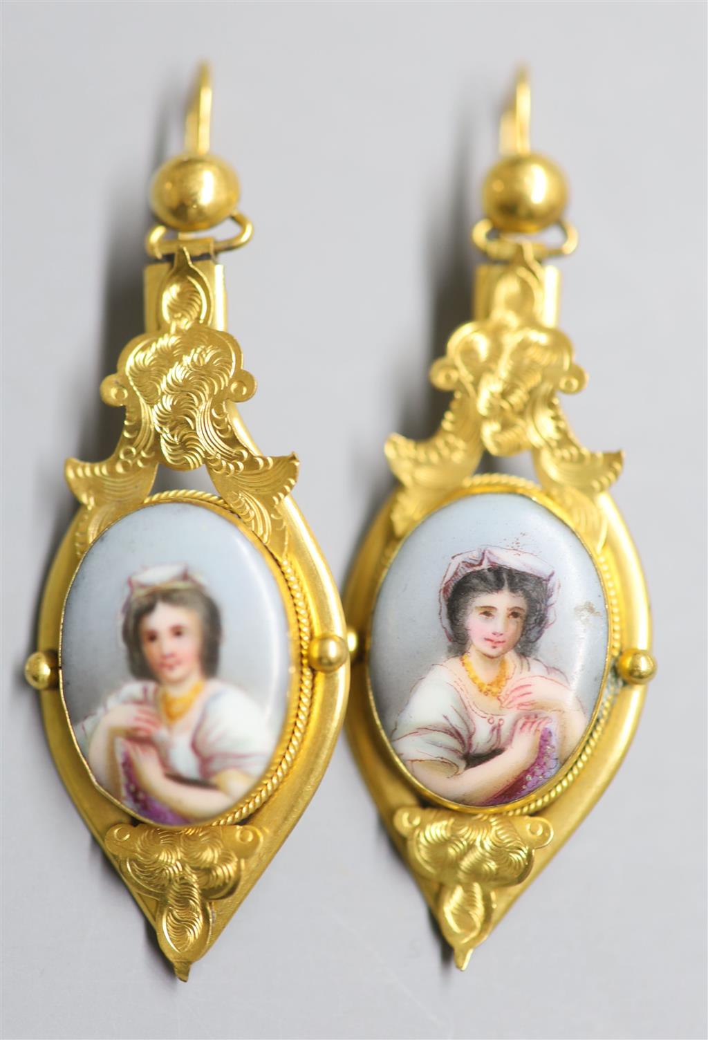 A pair of Victorian style? yellow metal and inset porcelain plaque drop earrings, 52mm, gross 8.4 grams,